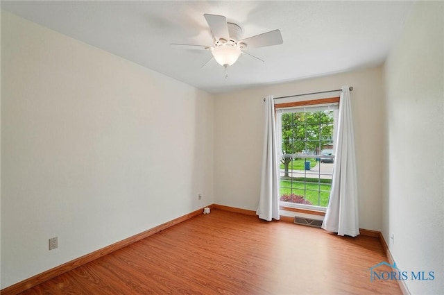 864 Cherry Ln, Waterville, OH 43566 - spare room featuring wood finished floors, baseboards, and a ceiling fan