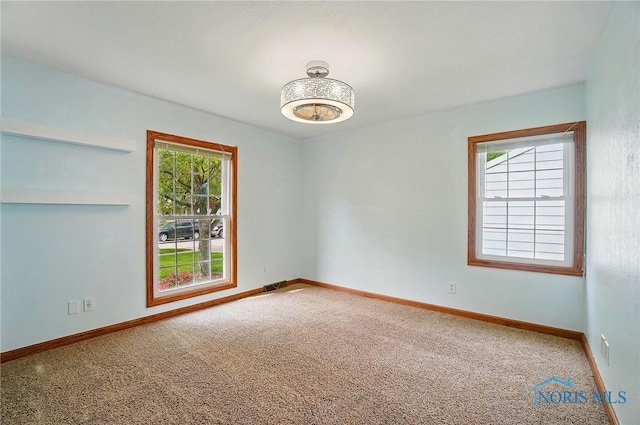864 Cherry Ln, Waterville, OH 43566 - spare room featuring carpet flooring and baseboards