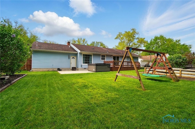 864 Cherry Ln, Waterville, OH 43566 - rear view of house featuring a hot tub, a playground, and a patio