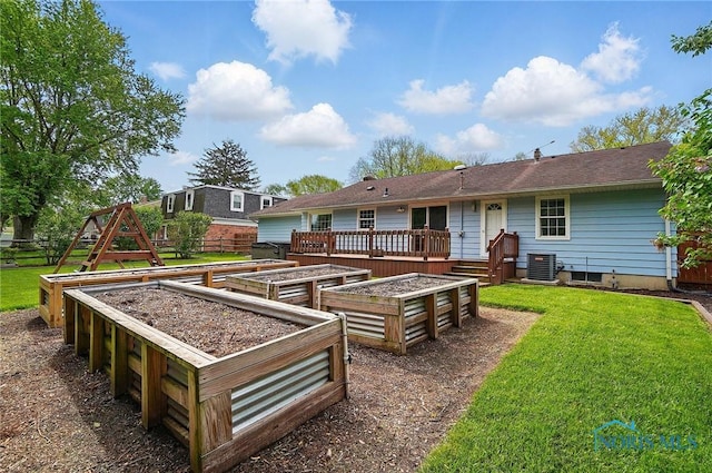 864 Cherry Ln, Waterville, OH 43566 - rear view of property featuring a garden and central AC unit