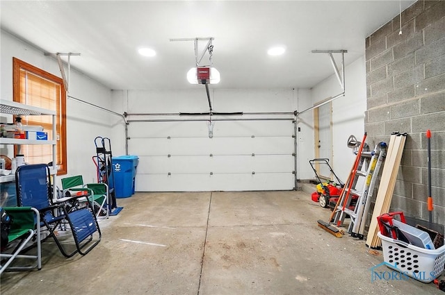 864 Cherry Ln, Waterville, OH 43566 - garage featuring a garage door opener and recessed lighting