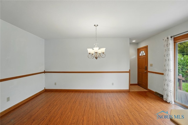 864 Cherry Ln, Waterville, OH 43566 - unfurnished room featuring light wood-type flooring, a chandelier, baseboards, and recessed lighting