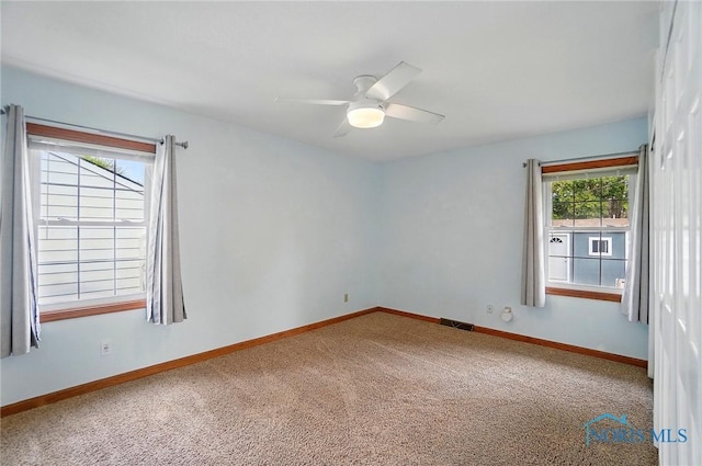 864 Cherry Ln, Waterville, OH 43566 - carpeted spare room with ceiling fan and baseboards