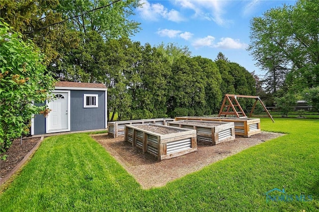 864 Cherry Ln, Waterville, OH 43566 - view of grassy yard with a garden, an outdoor structure, and a shed