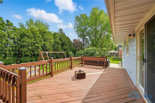 864 Cherry Ln, Waterville, OH 43566 - wooden deck featuring a playground and fence