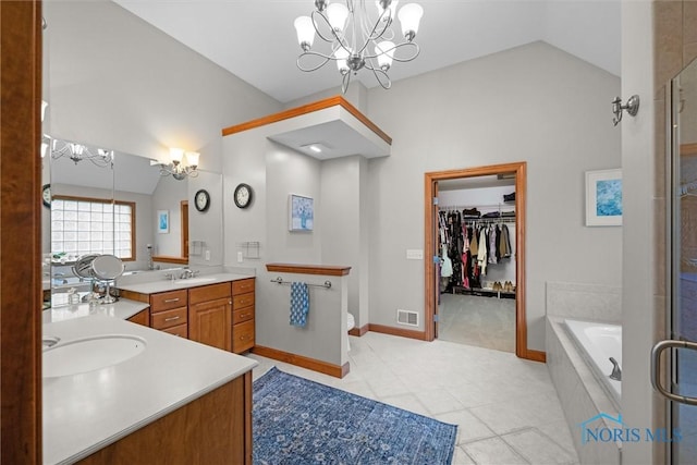 full bathroom featuring vaulted ceiling, a chandelier, tile patterned floors, vanity, and an enclosed shower