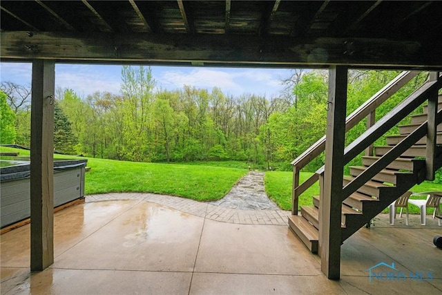 doorway to outside with a view of trees and stairway