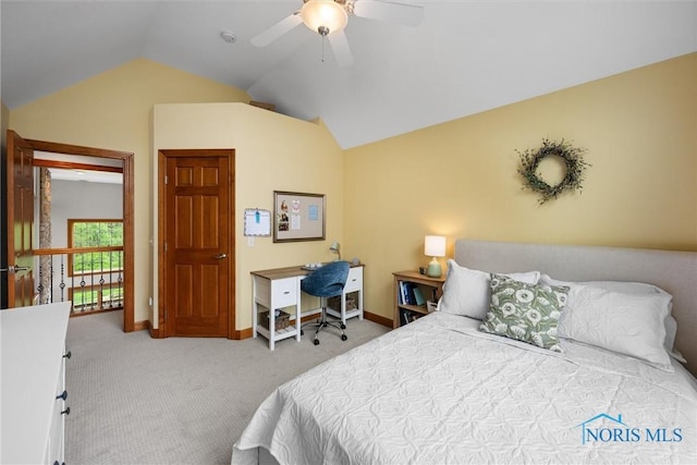 bedroom featuring vaulted ceiling, carpet flooring, baseboards, and a ceiling fan