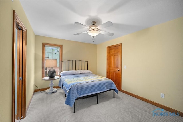bedroom with baseboards, light carpet, and ceiling fan