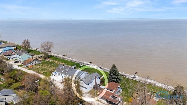 drone / aerial view featuring a residential view and a water view
