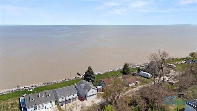 birds eye view of property with a water view and a residential view