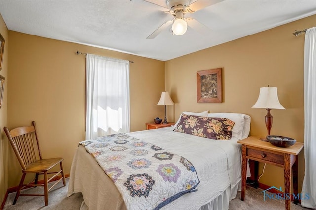 bedroom featuring ceiling fan, carpet flooring, and baseboards