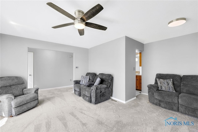 14384 Georgetown Dr, Bowling Green, OH 43402 - living area featuring baseboards, ceiling fan, and carpet floors