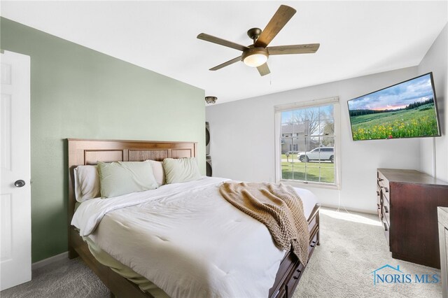 14384 Georgetown Dr, Bowling Green, OH 43402 - bedroom with light colored carpet, ceiling fan, and baseboards