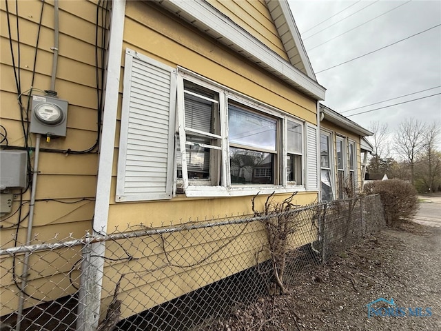 view of side of property with fence