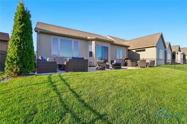 rear view of property featuring a fenced backyard, outdoor lounge area, a patio area, and a yard