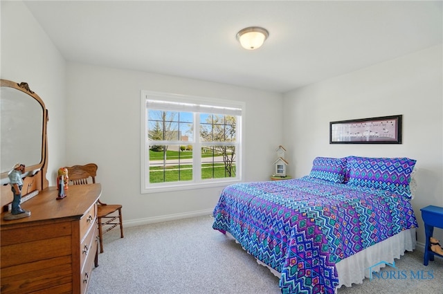 bedroom featuring baseboards and carpet floors