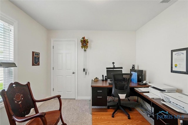 office space with baseboards