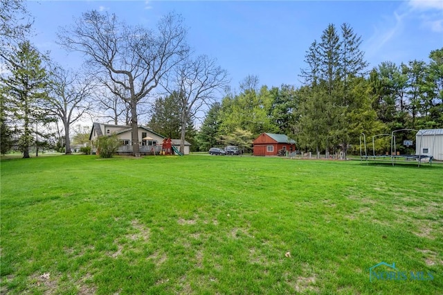 view of yard with a trampoline