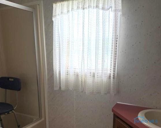 429 W Main St, Delta, OH 43515 - full bathroom featuring a shower with door and vanity