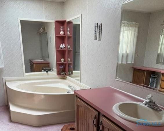 429 W Main St, Delta, OH 43515 - full bath featuring a bath, vanity, and a textured wall