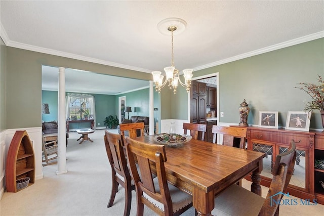 124 Miller Ave, Archbold, OH 43502 - dining room featuring crown molding, carpet, a chandelier, and decorative columns