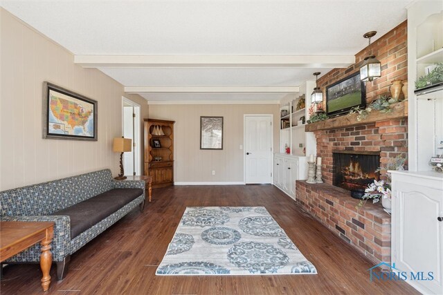 124 Miller Ave, Archbold, OH 43502 - living area with beam ceiling, wood finished floors, a fireplace, and baseboards