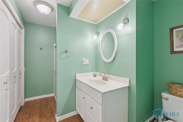 124 Miller Ave, Archbold, OH 43502 - bathroom with wood finished floors, vanity, toilet, and a stall shower