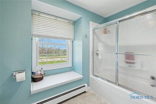 124 Miller Ave, Archbold, OH 43502 - bathroom with a baseboard heating unit, combined bath / shower with glass door, and baseboards