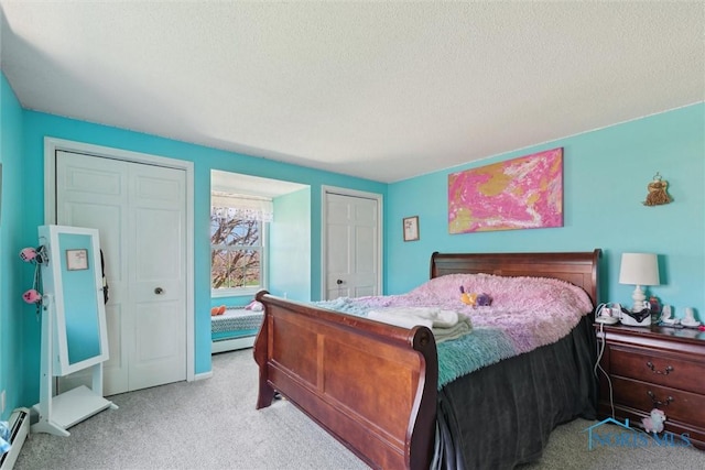 124 Miller Ave, Archbold, OH 43502 - bedroom featuring carpet flooring, a baseboard radiator, and a textured ceiling