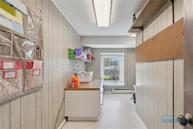 124 Miller Ave, Archbold, OH 43502 - interior space featuring wood walls, baseboard heating, and a textured ceiling