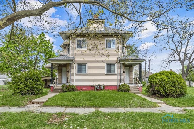 italianate home with a front lawn