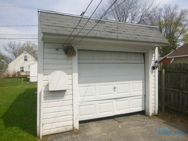 garage with fence