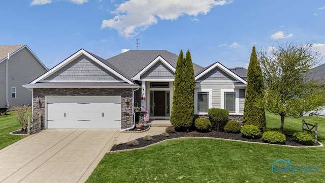 7704 Lonetree Ct, Maumee, OH 43537 - craftsman inspired home featuring stone siding, concrete driveway, a garage, and a front yard