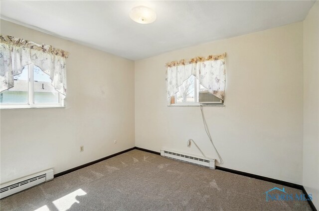 13417 Center St, Weston, OH 43569 - carpeted empty room with a baseboard heating unit, baseboards, and a healthy amount of sunlight