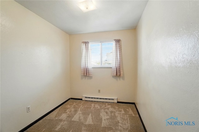 13417 Center St, Weston, OH 43569 - carpeted empty room with baseboards and a baseboard heating unit