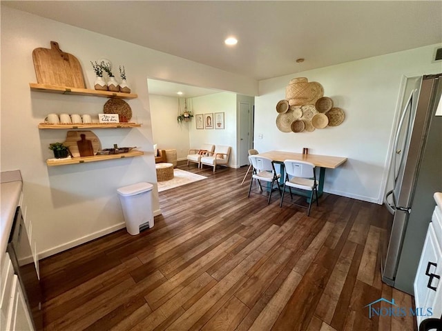 dining room with dark wood-style flooring, visible vents, recessed lighting, and baseboards