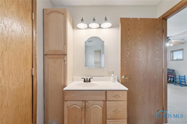 bathroom featuring a ceiling fan and vanity