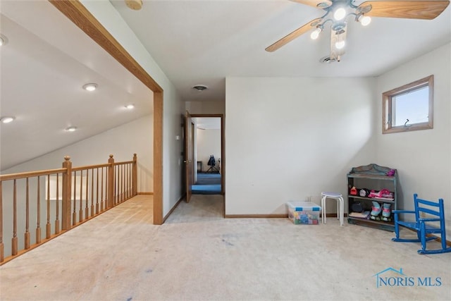 game room featuring ceiling fan, baseboards, and carpet