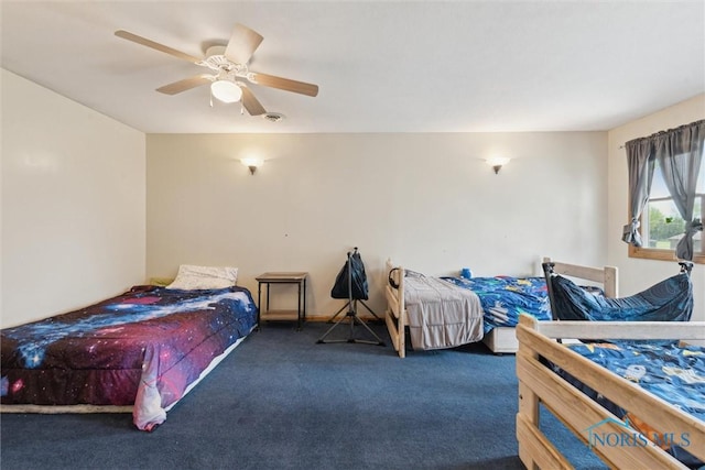 bedroom featuring carpet floors, a ceiling fan, and visible vents
