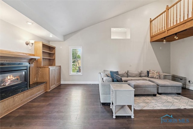 living room with baseboards, recessed lighting, dark wood finished floors, and vaulted ceiling