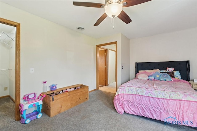 bedroom featuring baseboards, ceiling fan, carpet flooring, and visible vents