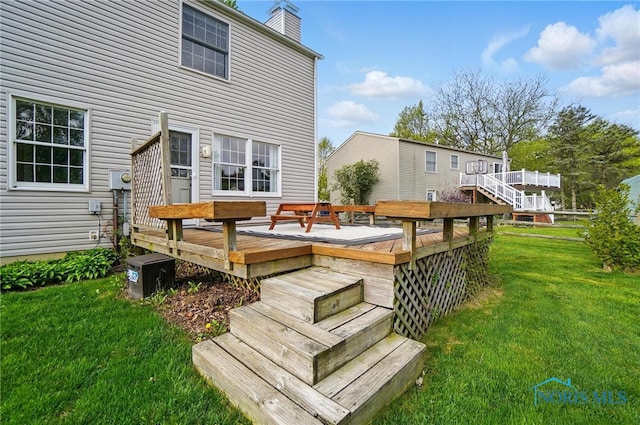 wooden deck with a yard