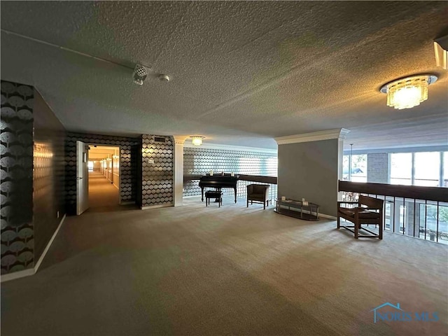 interior space with a wealth of natural light, carpet floors, and a textured ceiling