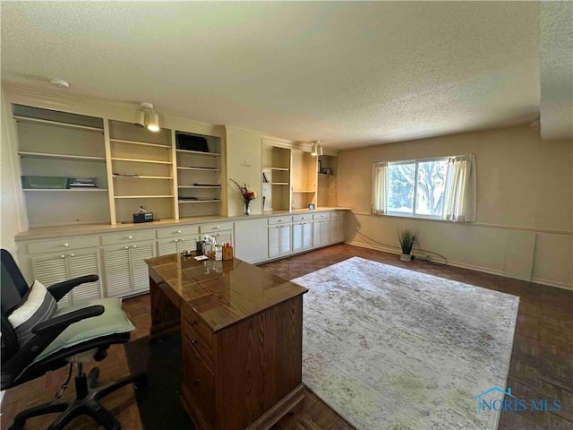 office with a textured ceiling and baseboards