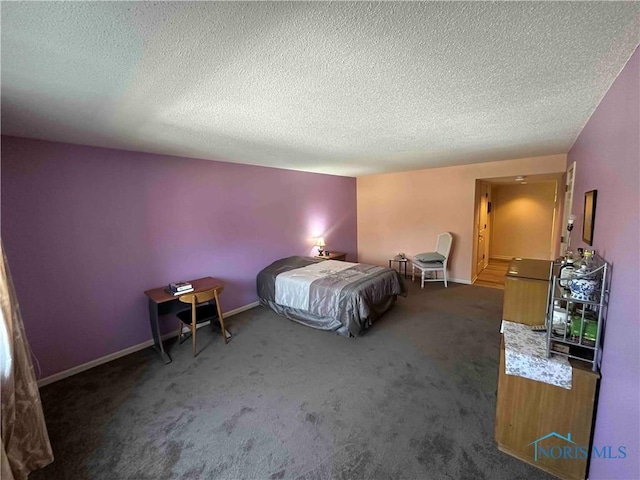 carpeted bedroom featuring a textured ceiling