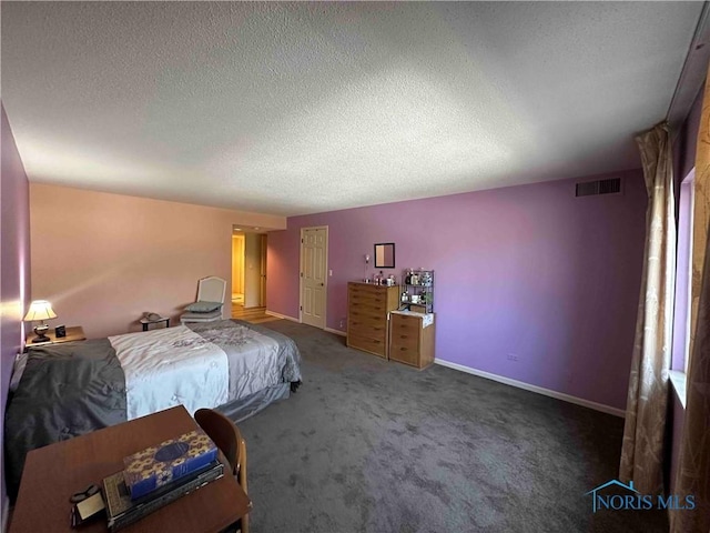 carpeted bedroom featuring a textured ceiling, visible vents, and baseboards