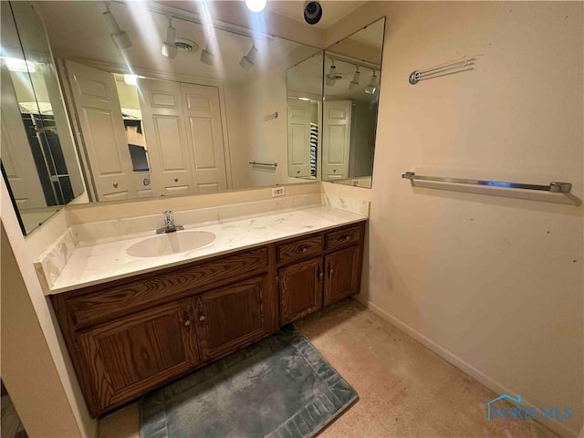 bathroom featuring vanity and baseboards