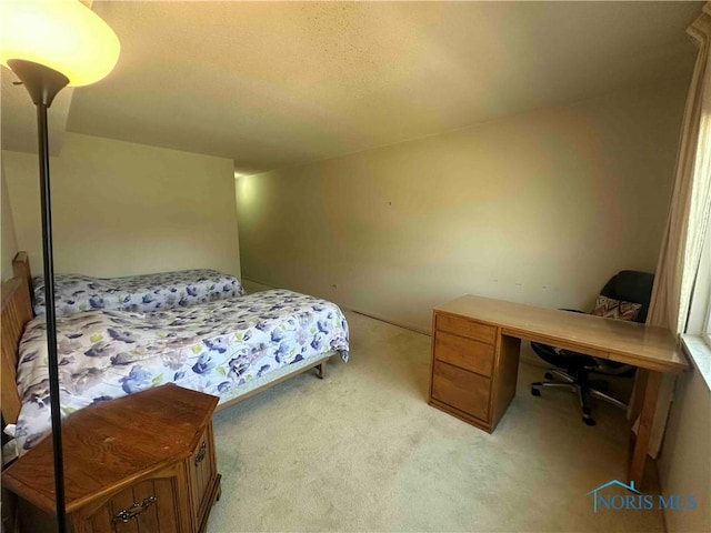 bedroom featuring light carpet