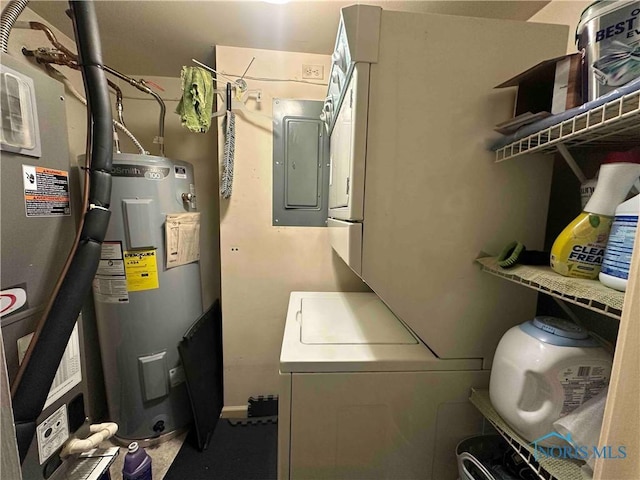 utilities with stacked washer / drying machine, heating unit, electric panel, and water heater